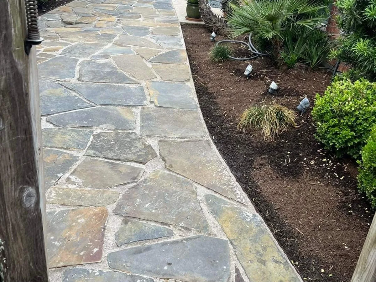 Flagstone walkway through a planted garden