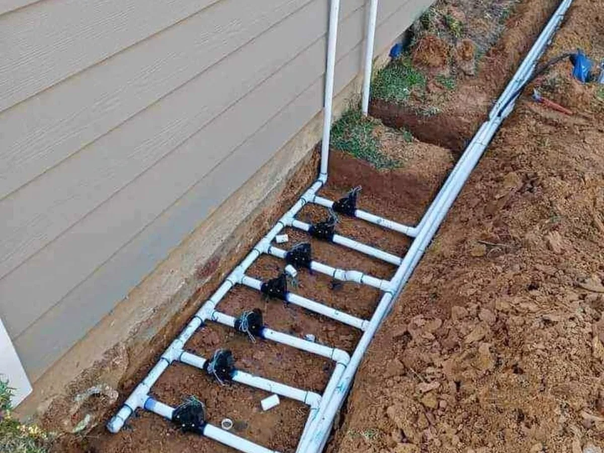 Sprinkler valve manifold installed beside a house
